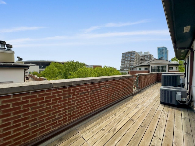 1429 S Prairie Ave, Chicago, IL 60605 - wooden deck featuring central AC unit and a city view