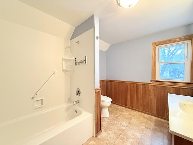1634 Scott Blvd, Geneva, IL 60134 - bathroom with toilet, vanity, lofted ceiling, wainscoting, and washtub / shower combination