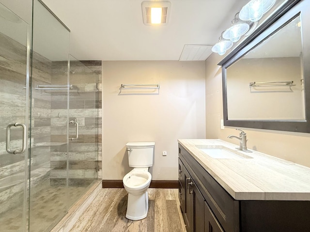 1634 Scott Blvd, Geneva, IL 60134 - full bath with wood finished floors, toilet, vanity, a shower stall, and baseboards