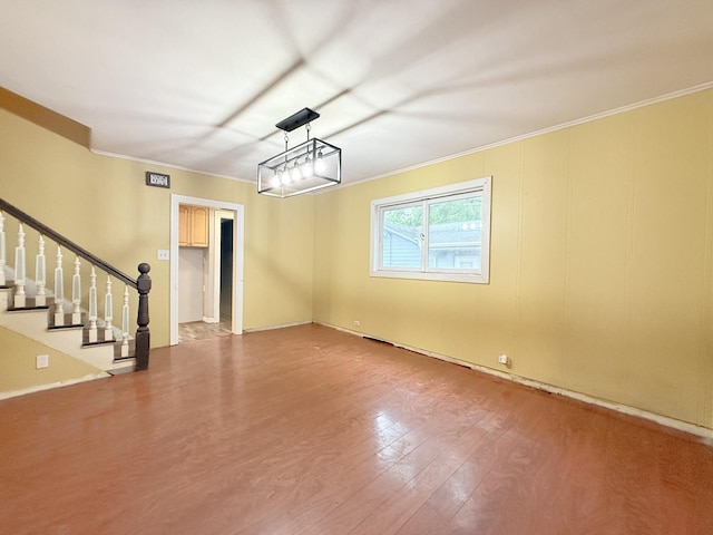 1634 Scott Blvd, Geneva, IL 60134 - unfurnished living room with ornamental molding, wood finished floors, stairway, and baseboards