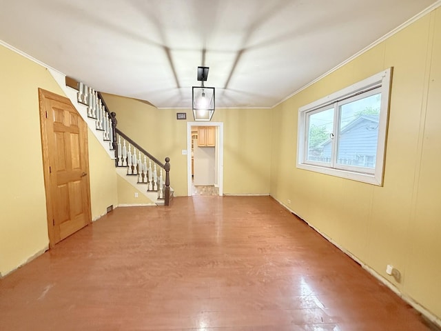 1634 Scott Blvd, Geneva, IL 60134 - unfurnished dining area featuring ornamental molding, stairs, wood finished floors, and baseboards