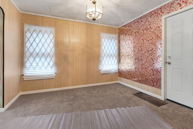 8505 S Seeley Ave, Chicago, IL 60620 - spare room with carpet floors, a chandelier, and ornamental molding