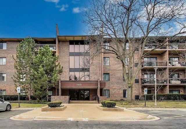 7525 Nantucket Dr Unit 106, Darien, IL 60561 - view of apartment building / complex featuring uncovered parking