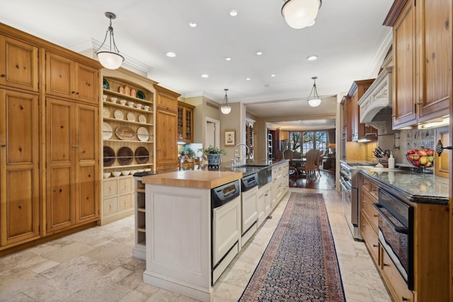 199 E Lake Shore Dr Unit 3, Chicago, IL 60611 - kitchen featuring open shelves, crown molding, an island with sink, double oven range, and stone tile flooring