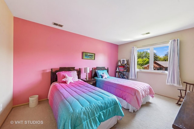 bedroom featuring carpet flooring and baseboards