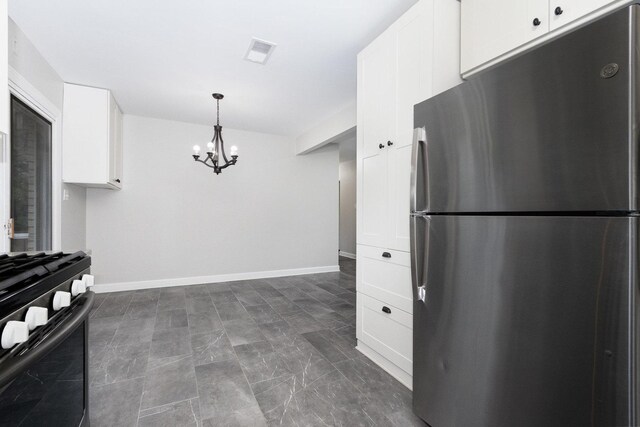 11S561 Saratoga Ave, Lemont, IL 60439 - kitchen with freestanding refrigerator, range with gas stovetop, a chandelier, white cabinets, and hanging light fixtures