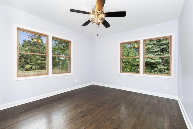 11S561 Saratoga Ave, Lemont, IL 60439 - empty room featuring plenty of natural light, baseboards, dark wood-type flooring, and ceiling fan
