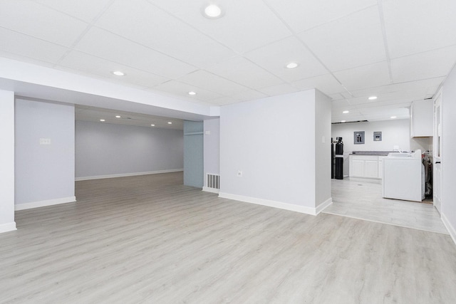 11S561 Saratoga Ave, Lemont, IL 60439 - unfurnished living room with washer / clothes dryer, recessed lighting, light wood-type flooring, a paneled ceiling, and baseboards