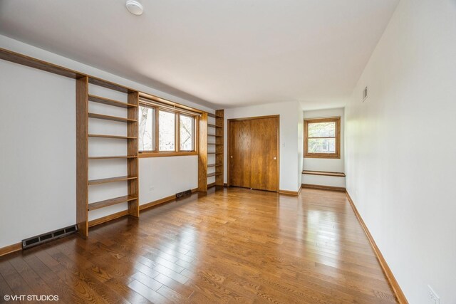 6483 Indianhead Trl, Indian Head Park, IL 60525 - unfurnished room with a smoke detector, wood finished floors, and baseboards