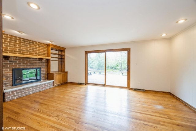 6483 Indianhead Trl, Indian Head Park, IL 60525 - unfurnished living room featuring light wood-style floors, a fireplace, baseboards, and recessed lighting