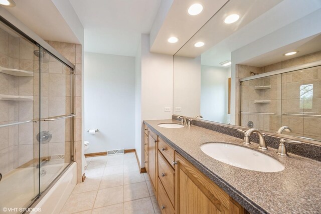 6483 Indianhead Trl, Indian Head Park, IL 60525 - full bathroom with recessed lighting, toilet, tile patterned flooring, baseboards, and double vanity