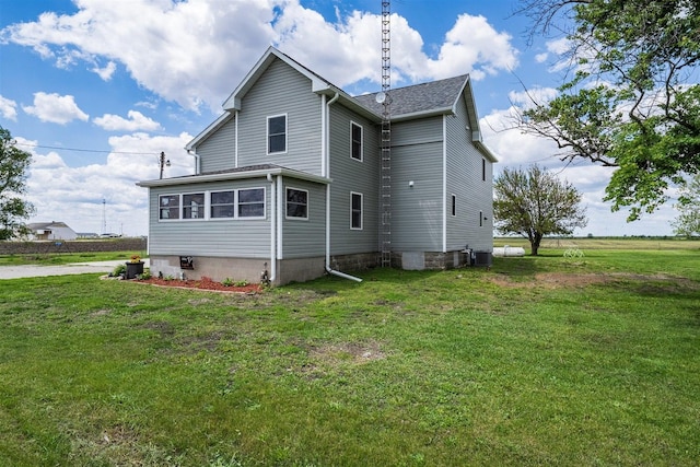 17469 N 300 E Rd, Flanagan, IL 61740 - back of house featuring a lawn and central air condition unit