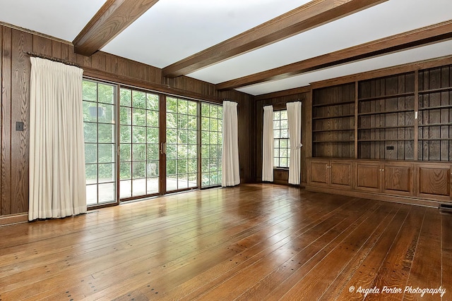 21293 N Andover Rd, Kildeer, IL 60047 - unfurnished living room featuring beam ceiling, wooden walls, and hardwood / wood-style floors