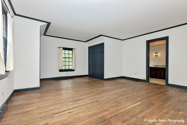 21293 N Andover Rd, Kildeer, IL 60047 - unfurnished bedroom with wood-type flooring, ornamental molding, and ensuite bathroom