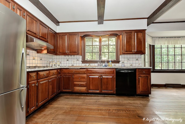 21293 N Andover Rd, Kildeer, IL 60047 - kitchen with freestanding refrigerator, black dishwasher, under cabinet range hood, dark wood-style floors, and backsplash