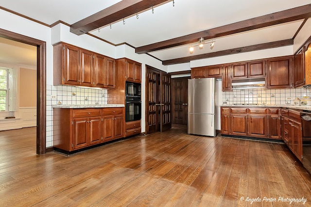21293 N Andover Rd, Kildeer, IL 60047 - kitchen with freestanding refrigerator, dark wood-type flooring, black microwave, under cabinet range hood, and beam ceiling