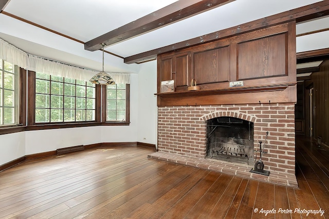 21293 N Andover Rd, Kildeer, IL 60047 - unfurnished living room with dark wood finished floors, beam ceiling, a brick fireplace, and healthy amount of natural light