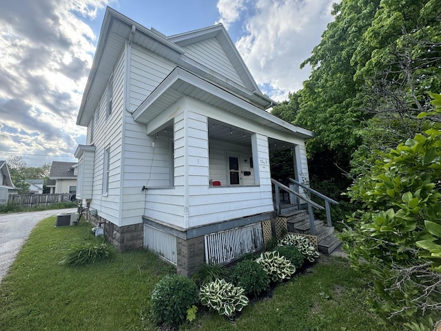 1309 S Main St, Bloomington, IL 61701 - view of property exterior with cooling unit and covered porch