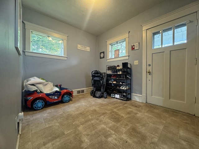 1309 S Main St, Bloomington, IL 61701 - entrance foyer featuring baseboards and a textured ceiling