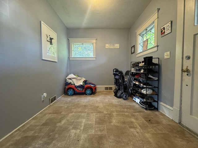 1309 S Main St, Bloomington, IL 61701 - interior space featuring baseboards and a textured ceiling