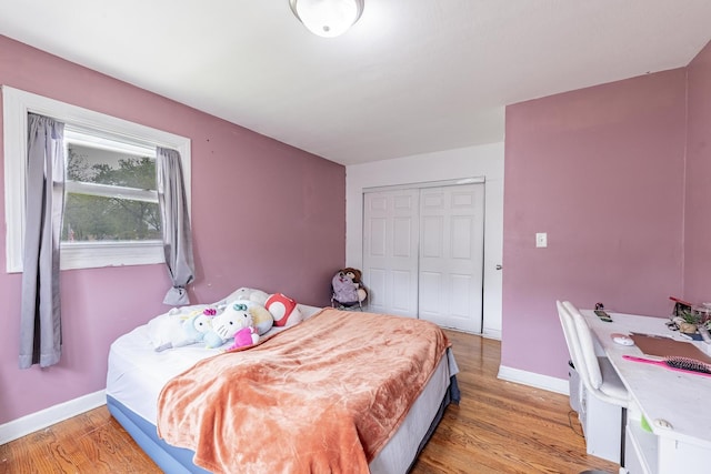 205 Glen St, West Chicago, IL 60185 - bedroom featuring baseboards, light wood finished floors, and a closet
