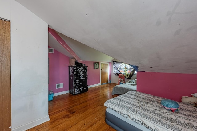 205 Glen St, West Chicago, IL 60185 - bedroom with wood finished floors, lofted ceiling, and baseboards