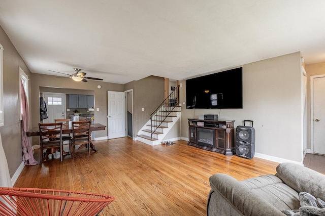 205 Glen St, West Chicago, IL 60185 - living room with light wood-type flooring, a ceiling fan, baseboards, and stairs