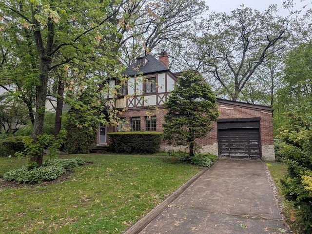 3107 Dato Ave, Highland Park, IL 60035 - view of front of property featuring brick siding, concrete driveway, a chimney, a garage, and a front lawn