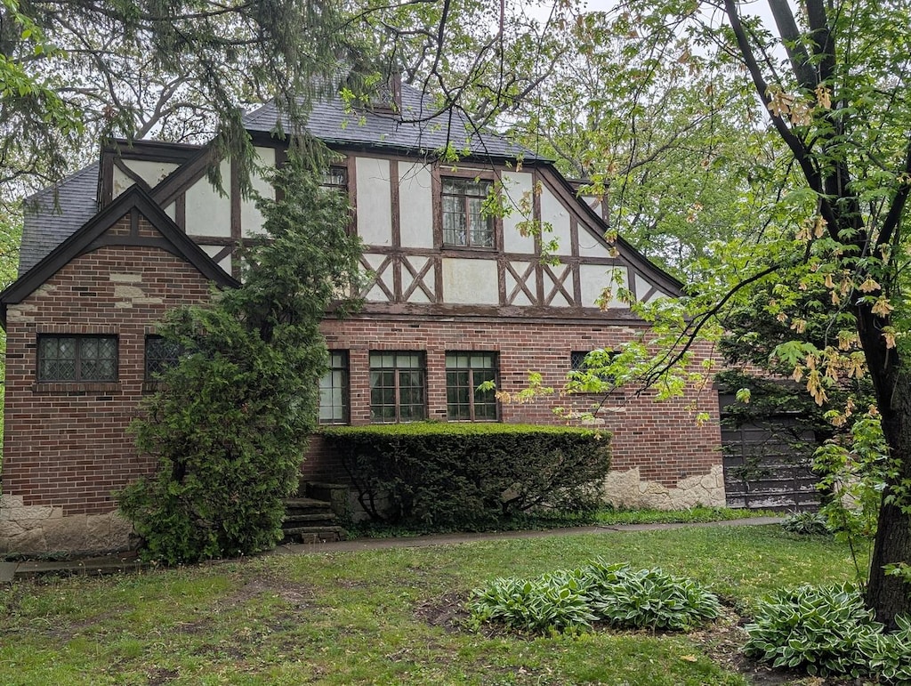 3107 Dato Ave, Highland Park, IL 60035 - view of side of property featuring stucco siding, brick siding, and a yard