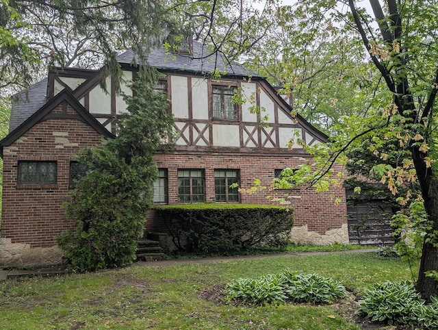 3107 Dato Ave, Highland Park, IL 60035 - view of side of property featuring stucco siding, brick siding, and a yard