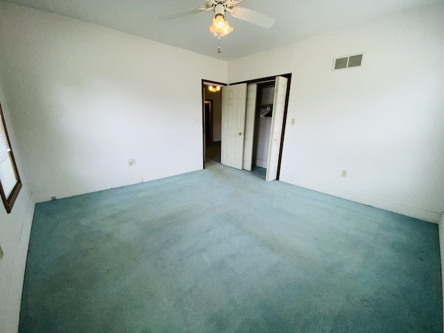807 W Washington St, Pontiac, IL 61764 - unfurnished bedroom with carpet flooring, ceiling fan, and a closet