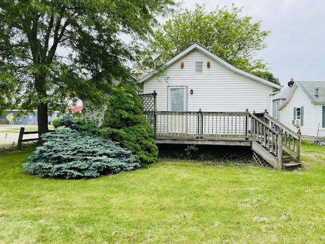 807 W Washington St, Pontiac, IL 61764 - back of property with a lawn and a deck