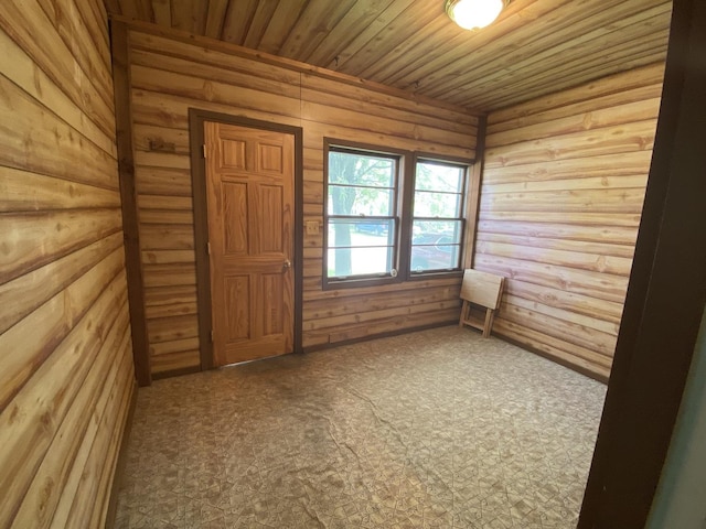807 W Washington St, Pontiac, IL 61764 - spare room featuring wood walls, wood ceiling, and carpet