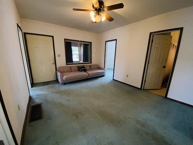 807 W Washington St, Pontiac, IL 61764 - unfurnished bedroom featuring carpet, baseboards, and ceiling fan