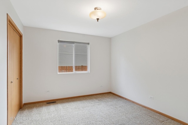 5203 Brighton Ln, Plainfield, IL 60586 - unfurnished bedroom with a closet, carpet flooring, and baseboards