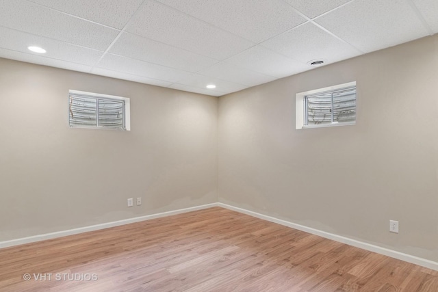 5203 Brighton Ln, Plainfield, IL 60586 - basement featuring a paneled ceiling, wood finished floors, baseboards, and recessed lighting