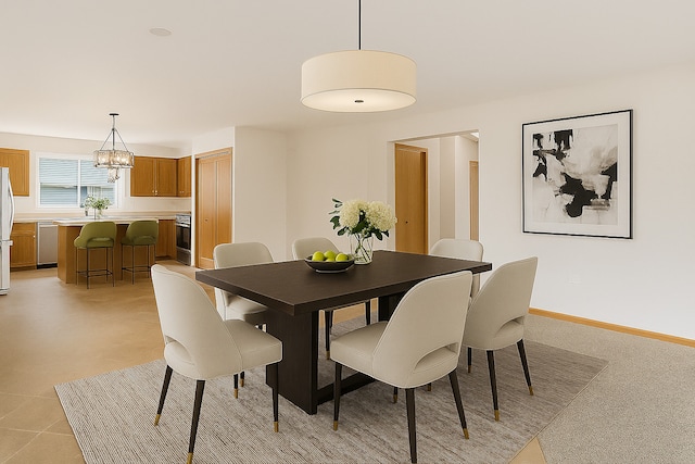 5203 Brighton Ln, Plainfield, IL 60586 - dining room featuring a chandelier and baseboards