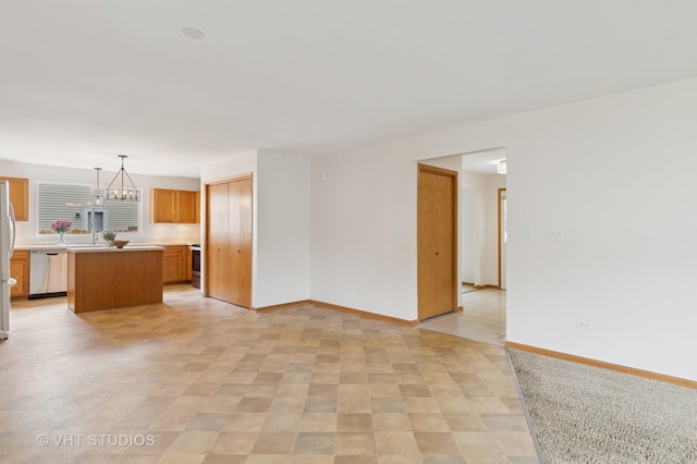 5203 Brighton Ln, Plainfield, IL 60586 - unfurnished living room with baseboards and a chandelier