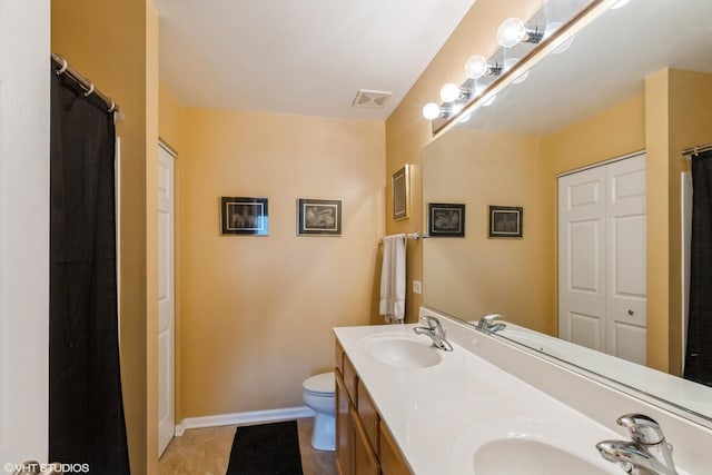 1532 Legacy Dr Unit 3, Dekalb, IL 60115 - full bathroom featuring double vanity, tile patterned flooring, toilet, baseboards, and curtained shower