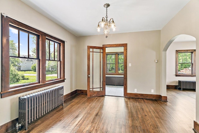 610 S 3rd St, Dekalb, IL 60115 - empty room featuring radiator and hardwood / wood-style floors