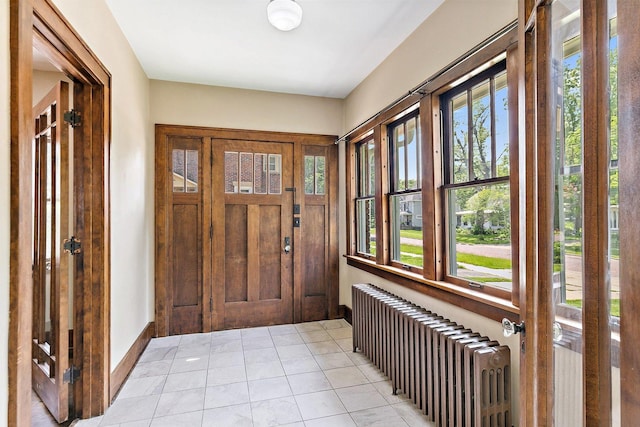 610 S 3rd St, Dekalb, IL 60115 - entrance foyer featuring radiator and light tile patterned floors