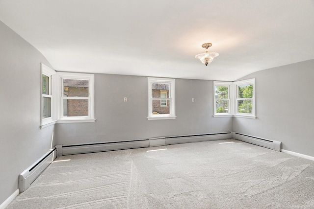 610 S 3rd St, Dekalb, IL 60115 - carpeted spare room featuring a baseboard heating unit, a chandelier, and lofted ceiling