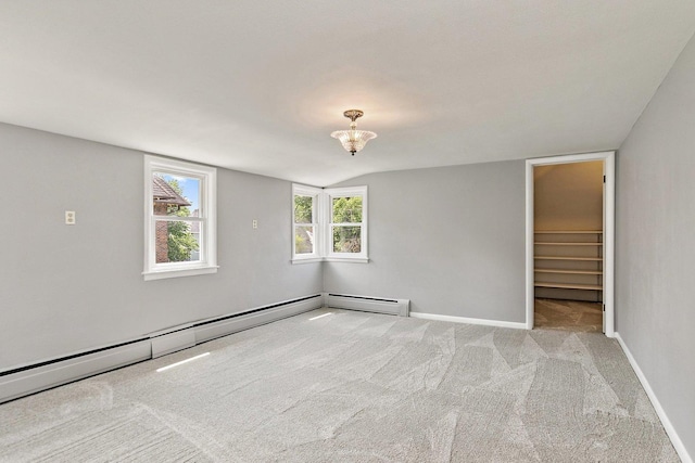 610 S 3rd St, Dekalb, IL 60115 - empty room with carpet, a chandelier, stairway, and a baseboard radiator