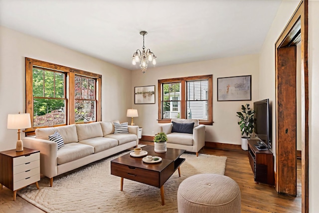 610 S 3rd St, Dekalb, IL 60115 - living room featuring a chandelier and wood finished floors