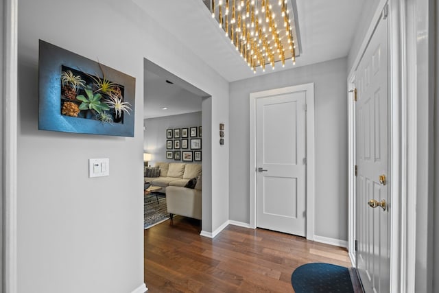 185 Carlisle Ave, Deerfield, IL 60015 - corridor with wood finished floors, baseboards, and a chandelier