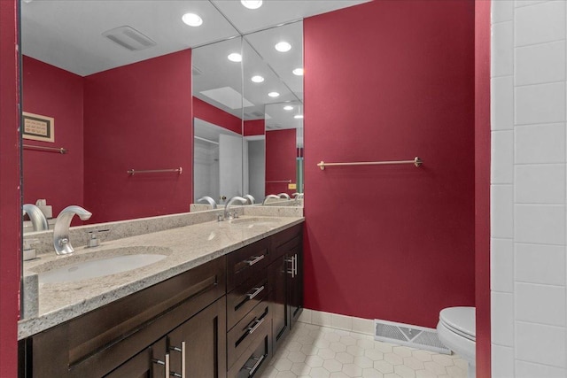 185 Carlisle Ave, Deerfield, IL 60015 - bathroom with tile patterned flooring, toilet, double vanity, recessed lighting, and baseboards