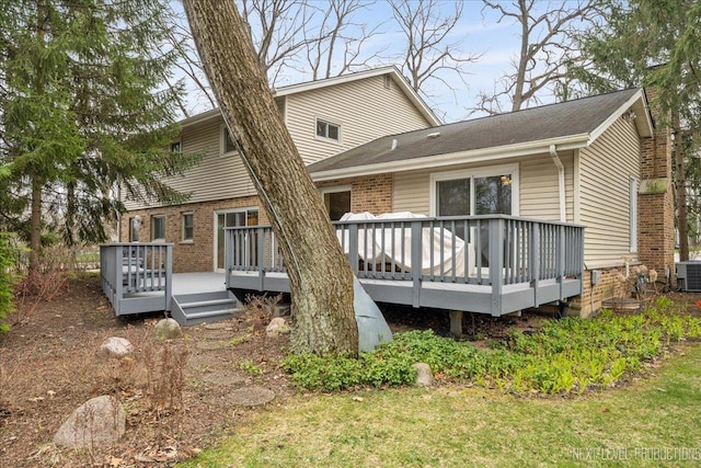 185 Carlisle Ave, Deerfield, IL 60015 - rear view of house featuring cooling unit, a wooden deck, and brick siding