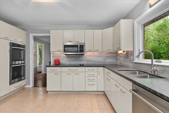 185 Carlisle Ave, Deerfield, IL 60015 - kitchen featuring stainless steel appliances, a sink, plenty of natural light, and decorative backsplash