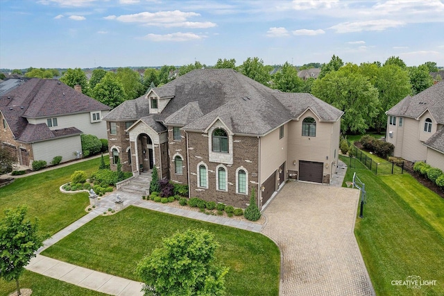 4748 Sassafras Ln, Naperville, IL 60564 - french country inspired facade with decorative driveway, a garage, and brick siding