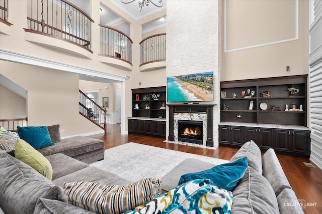 4748 Sassafras Ln, Naperville, IL 60564 - living room with a towering ceiling, dark wood-type flooring, crown molding, a fireplace, and stairway